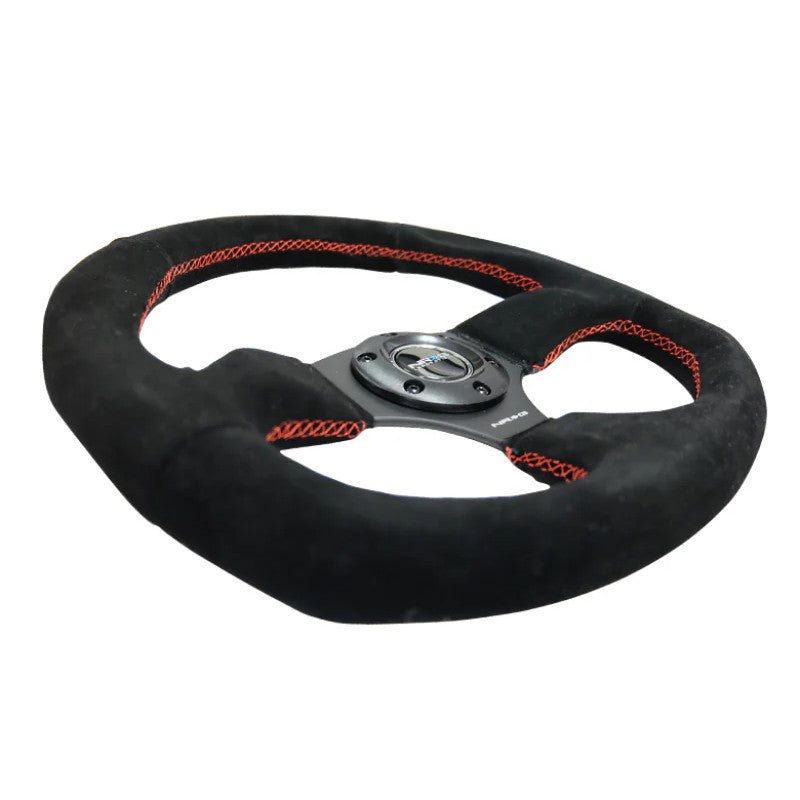 NRG Reinforced Suede Steering Wheel with red contrast stitching and a 320mm by 330mm oval rim profile.