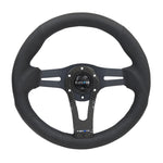 NRG Reinforced 320mm steering wheel with carbon fiber center spoke and 6-bolt mounting pattern.