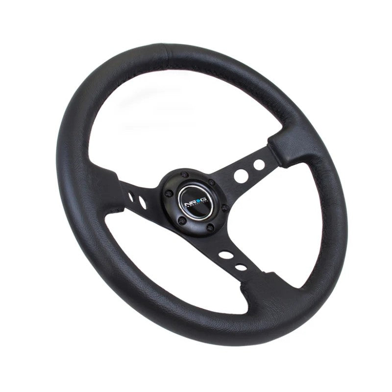 NRG 350mm black leather steering wheel with 3-inch deep dish and black spokes featuring circle cutouts.
