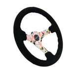 NRG 350mm black suede steering wheel with 3-inch deep dish, floral dipped center spokes, and black baseball stitching.