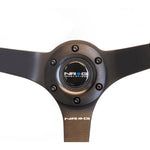 NRG Odi Bakchis Edition 350mm black suede steering wheel with 3-inch deep dish and black baseball stitching.