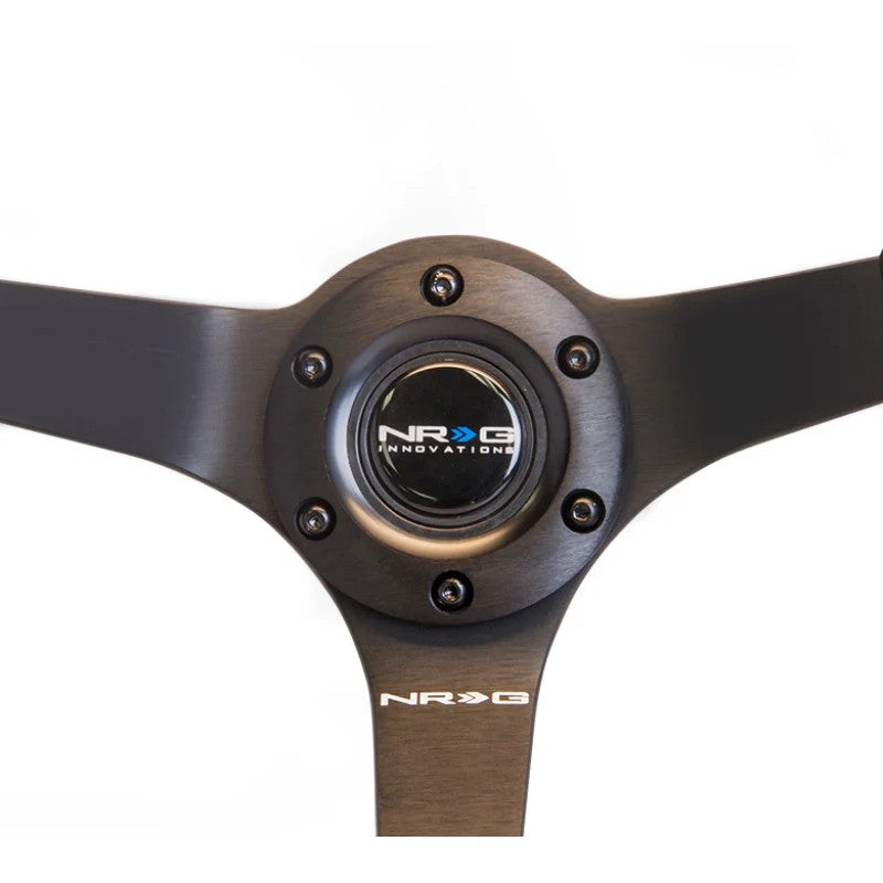 NRG Odi Bakchis Edition 350mm black suede steering wheel with 3-inch deep dish and black baseball stitching.