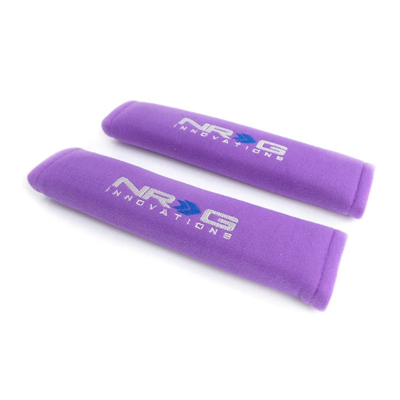 Pair of purple NRG 2.7-inch wide by 11-inch long short seat belt shoulder pads