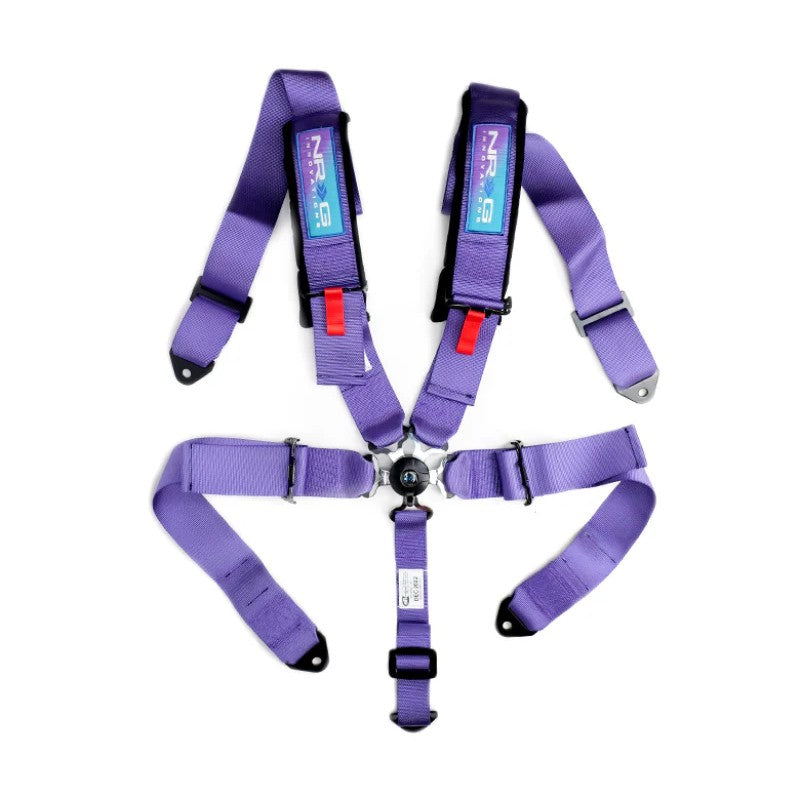 Purple NRG 5-point racing harness with 3-inch wide straps, SFI 16.1 safety tags, and a central cam lock buckle.