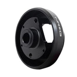 Black anodized NRG SRK-103H short steering wheel hub adapter for Subaru steering columns.