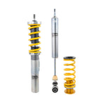 Ohlins Road & Track coilover kit with gold aluminum shock bodies and black springs for Audi and Volkswagen models.