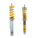 Ohlins Road and Track adjustable coilovers for Porsche 911 991 with gold-anodized aluminum shock bodies and black springs.