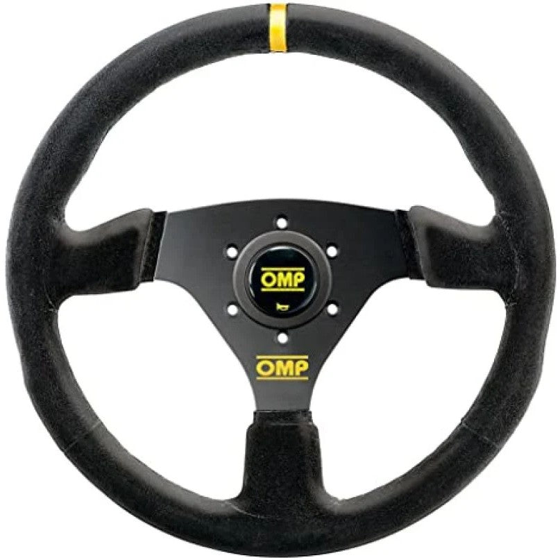 OMP Targa 330mm steering wheel featuring black suede grip and black anodized three-spoke design with horn button.