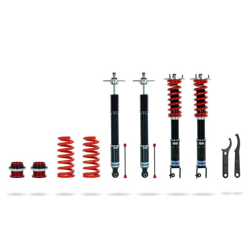 Pedders Extreme Xa adjustable monotube coilovers with red springs and factory-style mounting brackets.