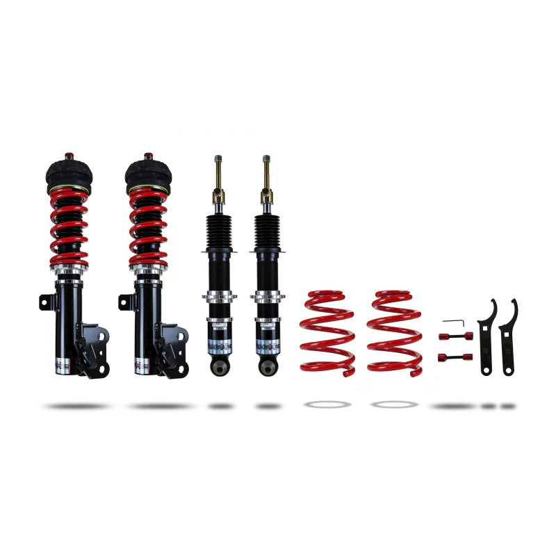 Pedders Extreme Xa adjustable monotube coilovers with red alloy springs and factory-style brackets for Chevrolet SS.