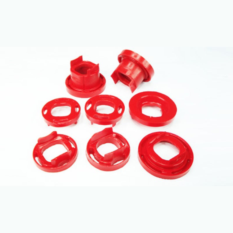 Four red Pedders urethane rear crossmember subframe bushing inserts for Pontiac G8 and Chevrolet SS.