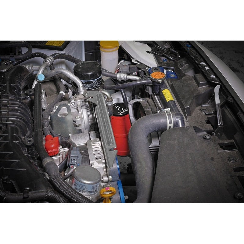 Red CNC-machined aluminum PERRIN coolant overflow tank for Subaru WRX, STI, and BRZ/GR86 models.