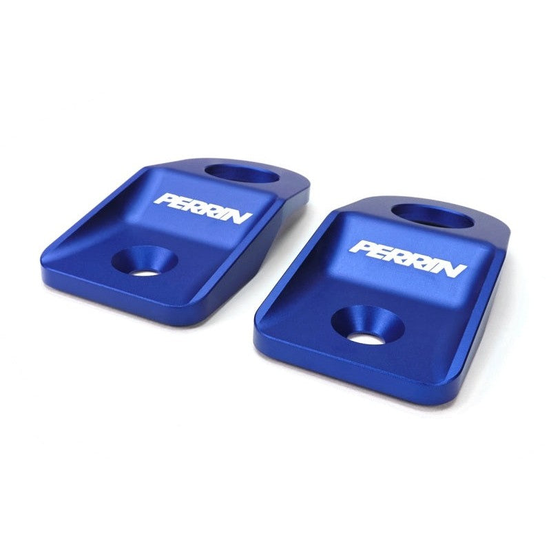 A pair of PERRIN blue anodized upper radiator brackets for 2008-2014 Subaru WRX and STI.