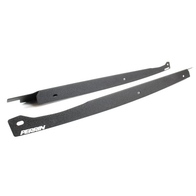 Pair of black PERRIN fender shrouds for 2008-2014 Subaru WRX and STI engine bay customization.