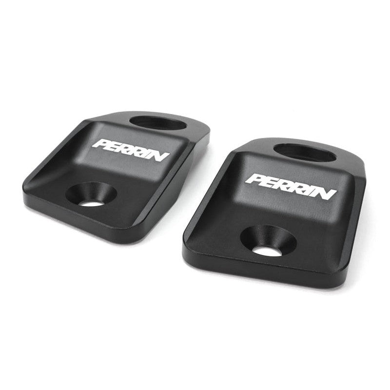 A pair of PERRIN black finished upper radiator brackets for Subaru WRX, STI, Crosstrek, and Impreza.