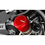 Red anodized PERRIN oil filter cover with laser-etched logo