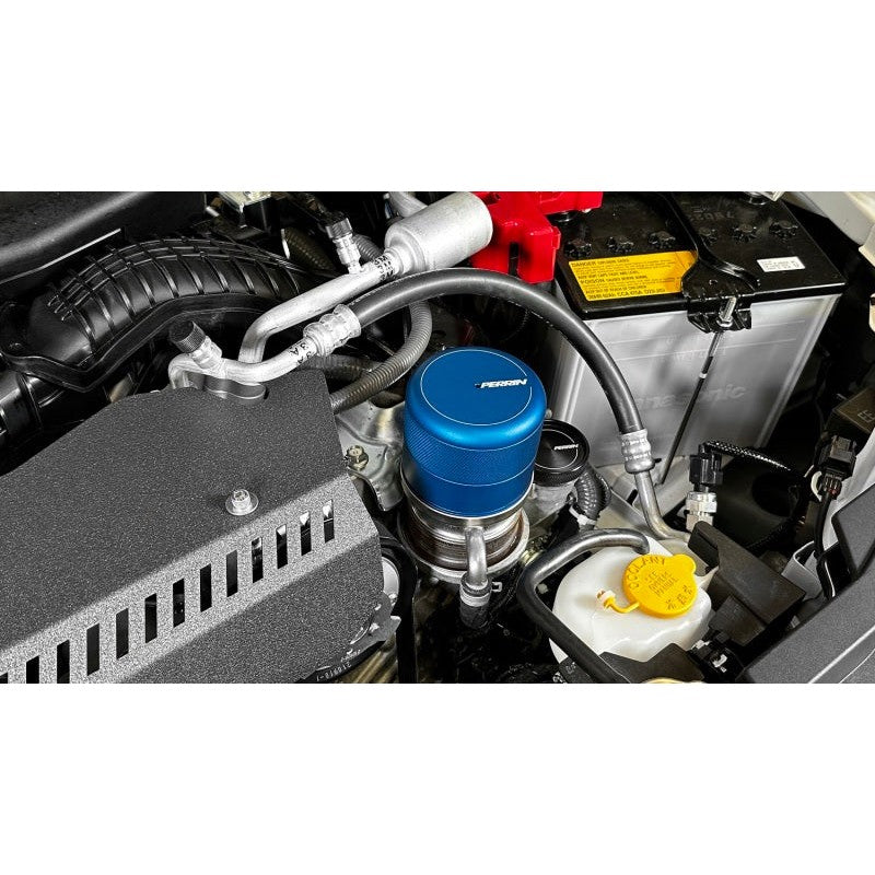 Blue anodized PERRIN CNC machined aluminum oil filter cover with PERRIN logo etching