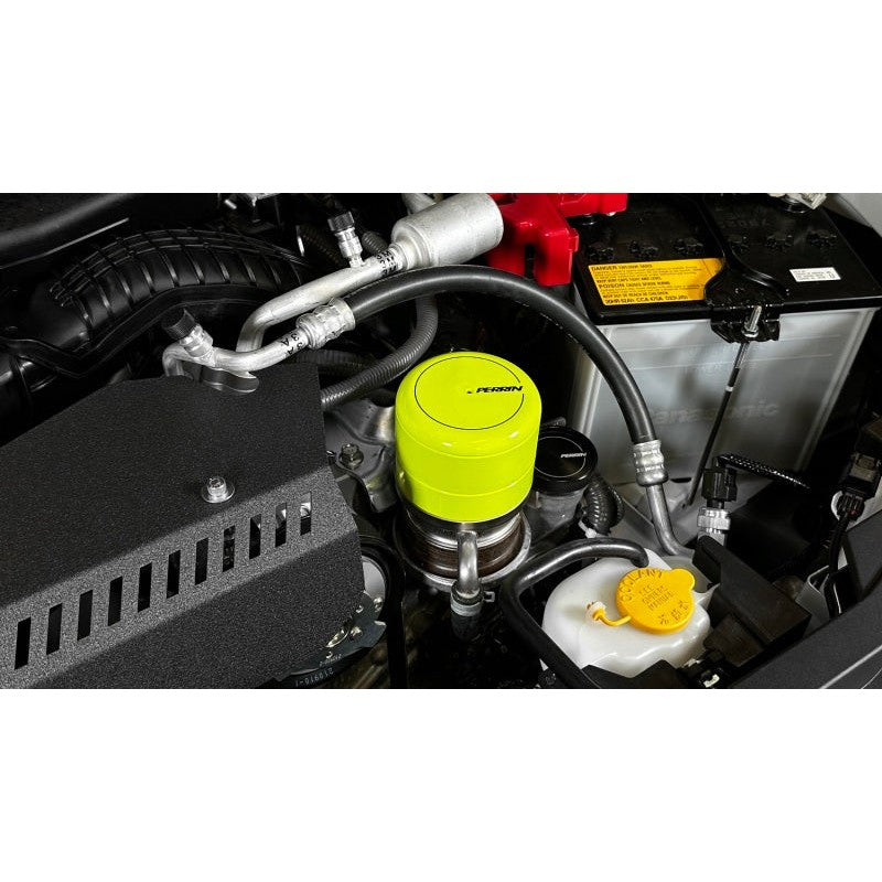 Neon yellow PERRIN oil filter cover for Subaru WRX and BRZ engines, part number PSP-ENG-716NY