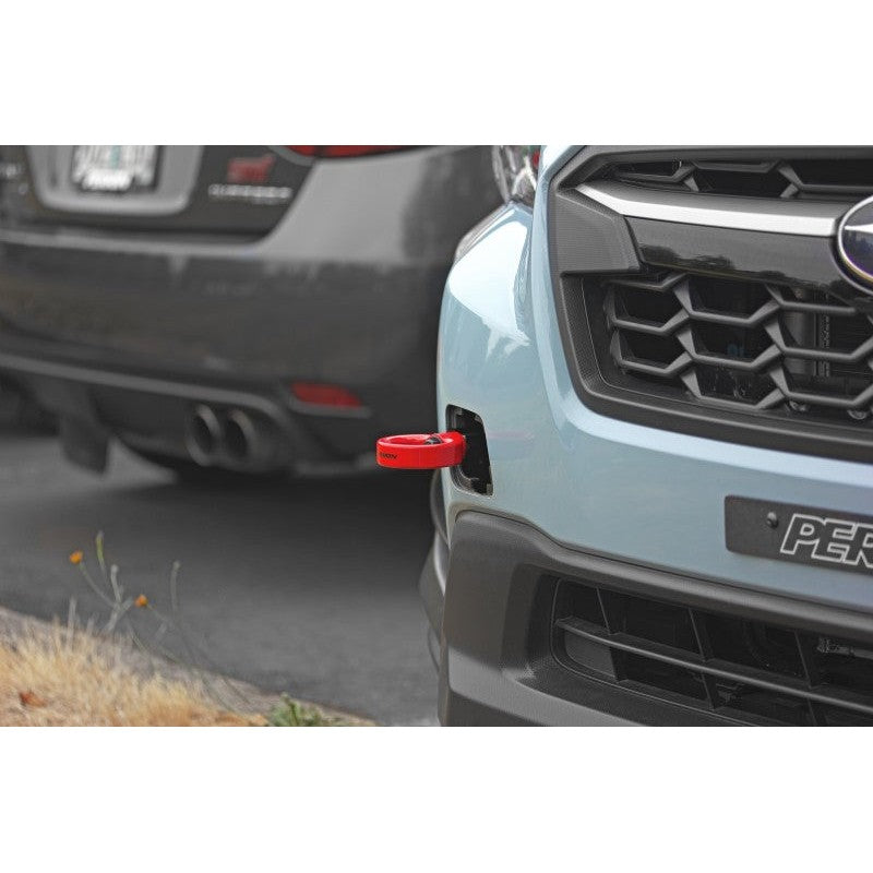 Red PERRIN front tow hook and threaded mounting bolt for select Subaru WRX and Crosstrek models.