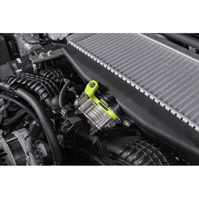 Neon yellow powder-coated PERRIN intercooler bracket for Subaru WRX, Ascent, Outback, and Legacy turbo models.