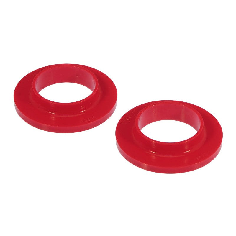 Red polyurethane Prothane rear upper coil spring isolator for GM suspension systems.