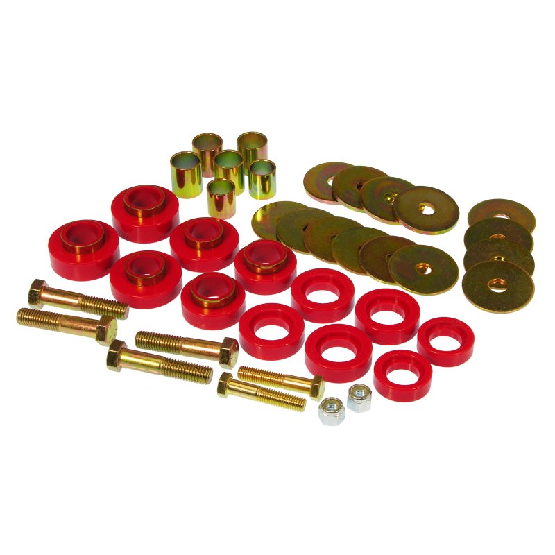 Red polyurethane body mount bushings with silver mounting hardware and bolts for classic Chevy and Pontiac models.