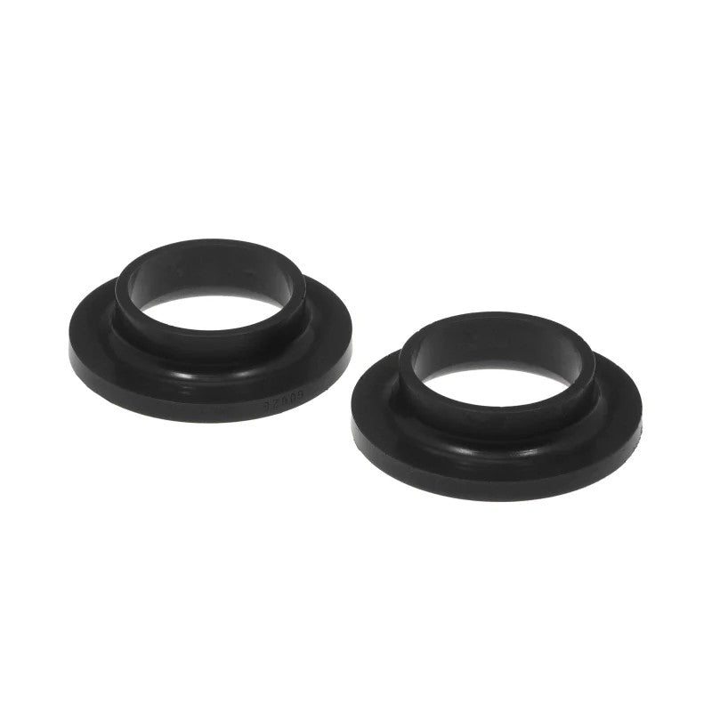 Two black Prothane universal polyurethane coil spring isolators for suspension noise dampening.
