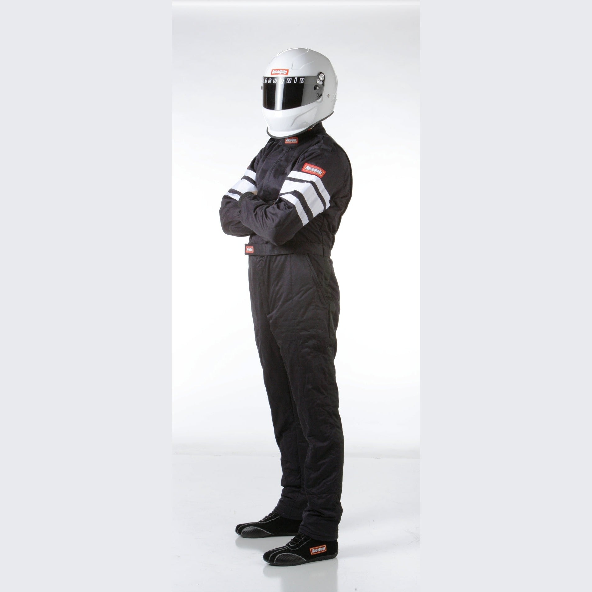 RaceQuip 120 Series black multi-layer fire suit with SFI 3.2A/5 patch, quilted stitching, and Nomex cuffs in size medium.
