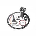 Radium CNC machined fuel hanger surge tank for Nissan 370Z featuring integrated collector box and pump mounting points.