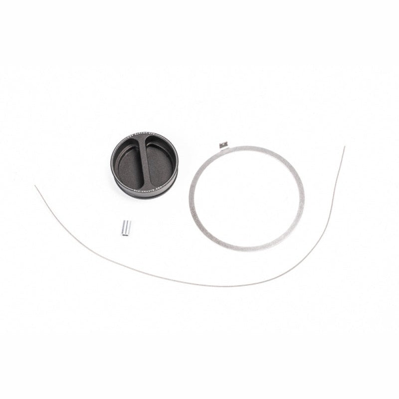 Radium Engineering black dust cap with attached security lanyard for dry break fuel cell fill receivers.