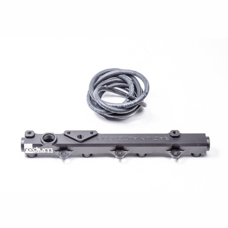 Black anodized Radium Engineering fuel rail for 2000-2005 Honda S2000 featuring 8AN ORB ports and CNC construction.