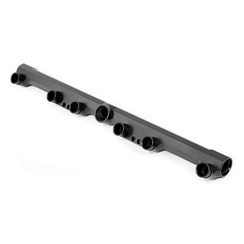 Black anodized Radium Engineering high-flow fuel rail for Volkswagen 2.8L 12V VR6 engines with mounting hardware.