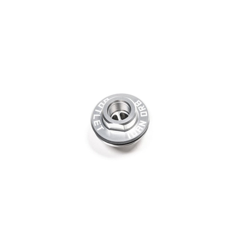 Radium Engineering fuel filter outlet cap featuring an integrated internal check valve mechanism for fuel system priming.
