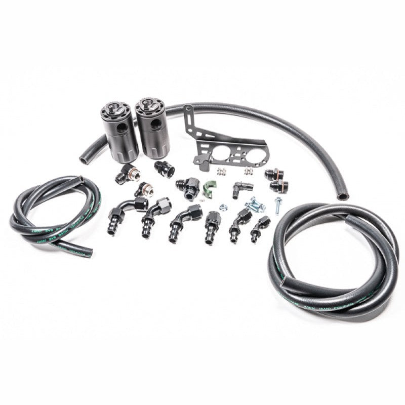 Two black anodized Radium Engineering catch cans with mounting brackets and hoses for Lamborghini Gallardo LP.