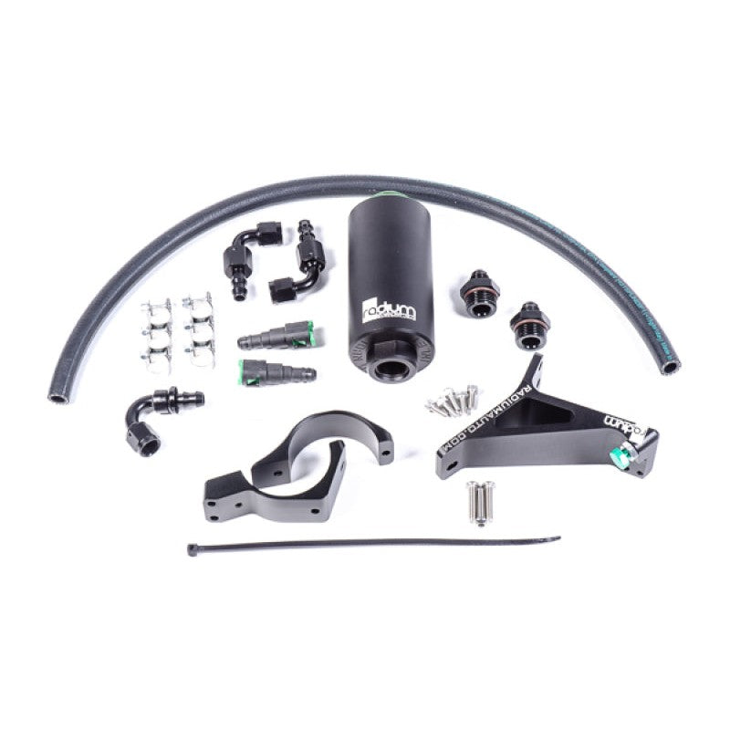 Radium Engineering microglass fuel filter mounted on a master cylinder brace with associated fuel hoses and fittings.