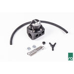 Radium Engineering FPD-XR inline fuel pulse damper featuring 8AN ORB ports and an integrated 1/8 inch NPT gauge port