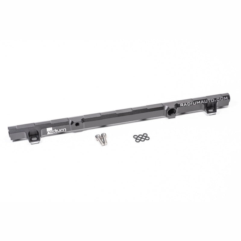 Radium Engineering CNC-machined high-flow fuel rail for Nissan RB20DET engines featuring 8AN ORB ports.