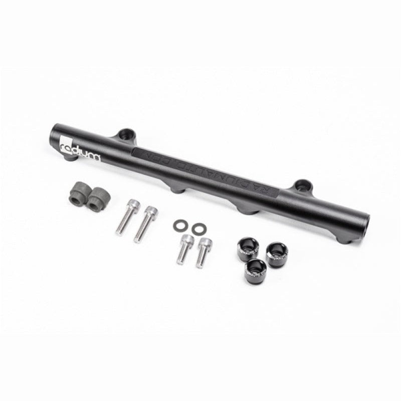 Black anodized Radium Engineering secondary fuel rail for Mazda 20B-REW 3-rotor engines.