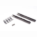 Black anodized Radium Engineering fuel rails for Nissan VQ engines showing 8AN ORB ports and laser engraving.