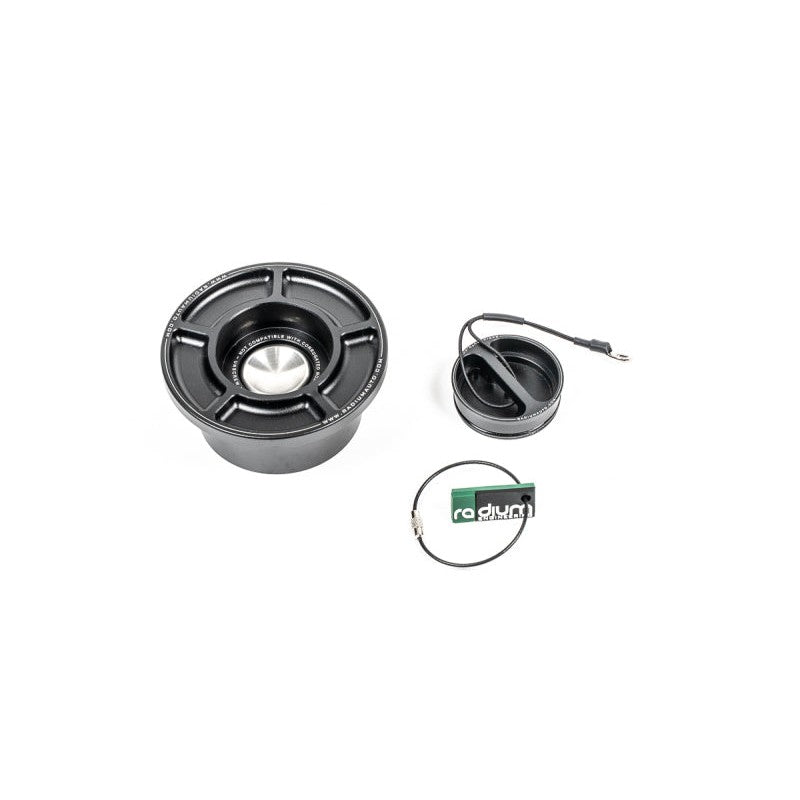 Radium Engineering SVF capless fuel filler assembly featuring a spring-loaded swing valve door and tethered dust cap.