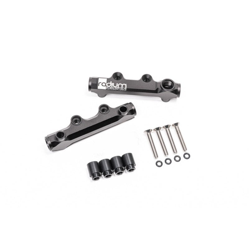 Radium Engineering black anodized aluminum top feed fuel rails with auxiliary top ports for Subaru EJ-series engines.