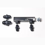 Black anodized Radium Engineering universal 4-port vacuum and boost manifold with laser-etched logo