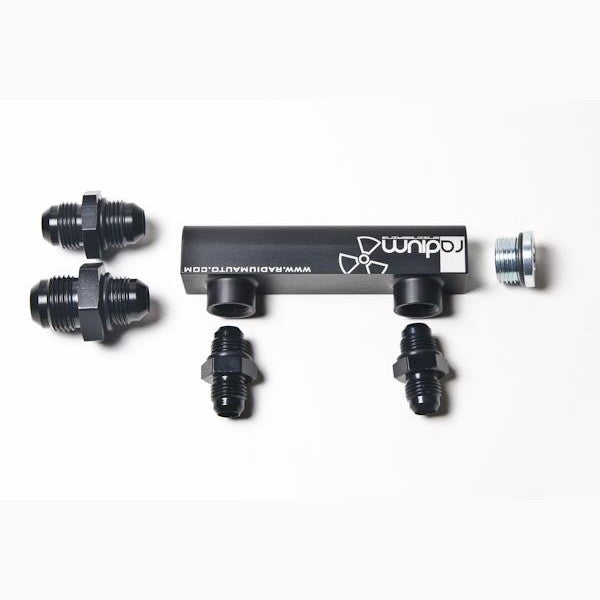 Black anodized Radium Engineering universal 4-port vacuum and boost manifold with laser-etched logo