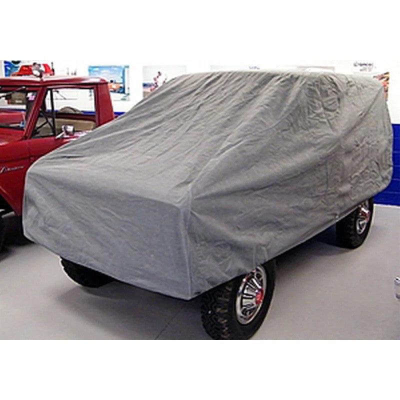 Grey Rampage 4-layer breathable car cover custom-fitted to a 1966-1977 Ford Bronco.