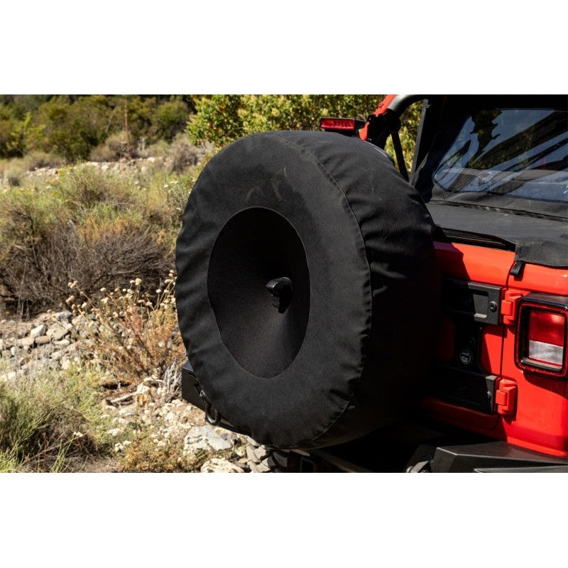 Rampage 30-ounce black twill spare tire cover with center backup camera slot for Jeep Wrangler