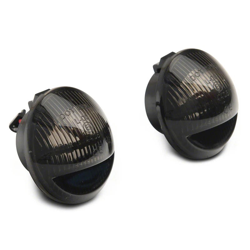 Raxiom Axial Series LED license plate light assemblies with clear lenses and black housings for 2001-2014 Ford F-150