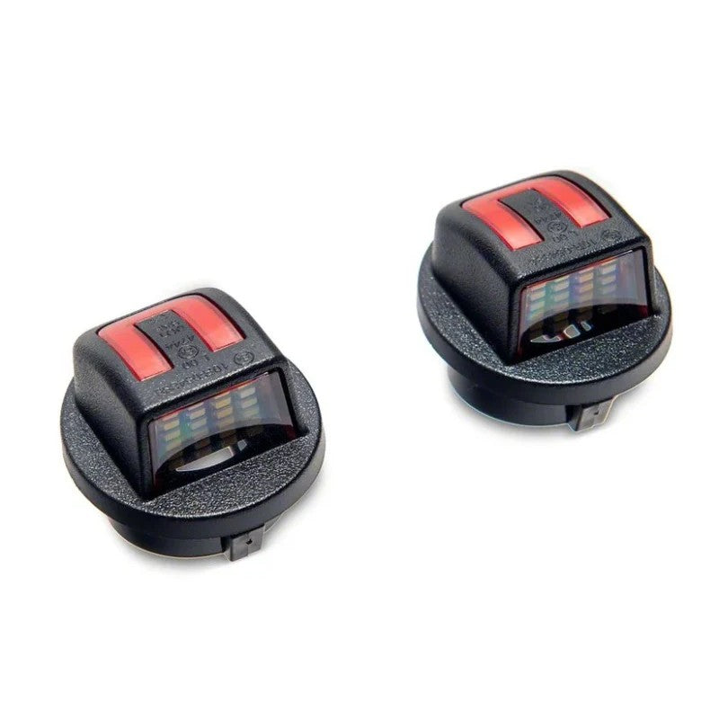 Pair of Raxiom LED license plate light assemblies with white and red LEDs for 2004-2014 Ford F-150.