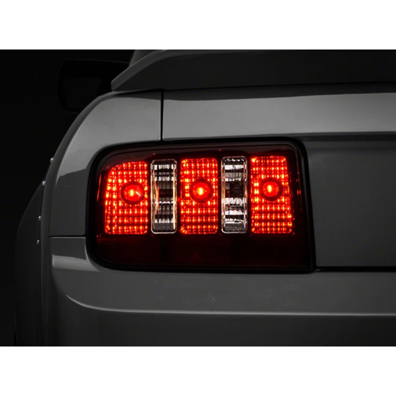 Raxiom Coyote tail lights for 2005-2009 Ford Mustang featuring black housings and smoked lenses.