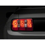 Raxiom Coyote style tail lights for 2005-2009 Ford Mustang with chrome housings and red/clear lenses.