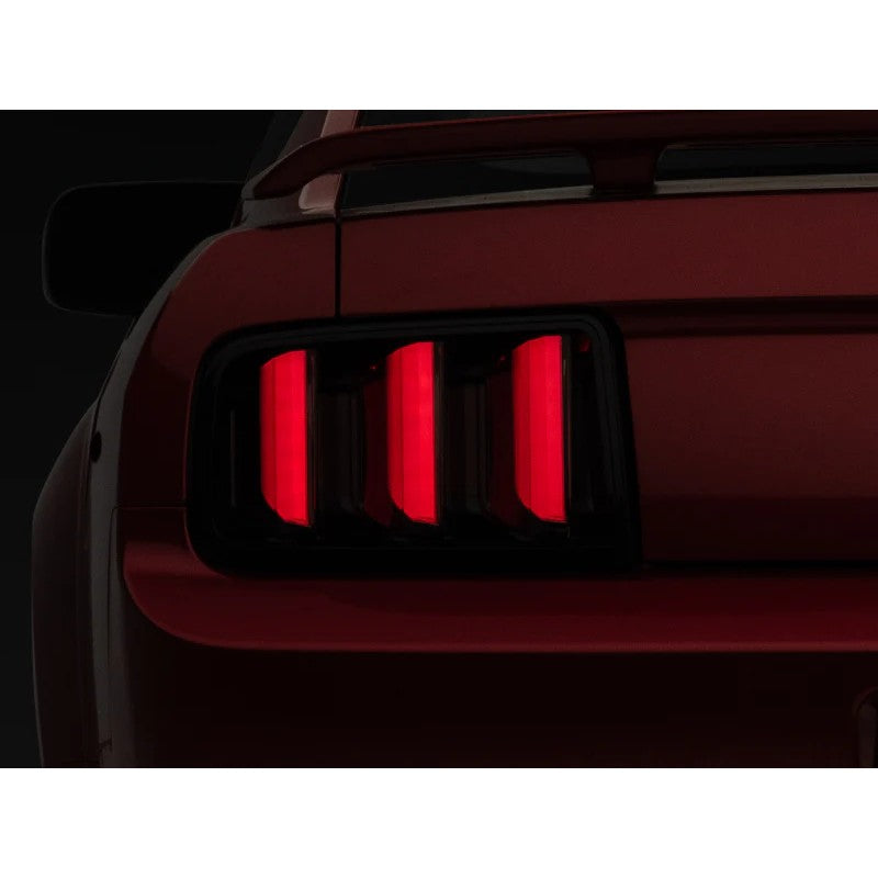 Raxiom Vector V2 LED tail lights with black housings and smoked lenses for 2005-2009 Ford Mustang.